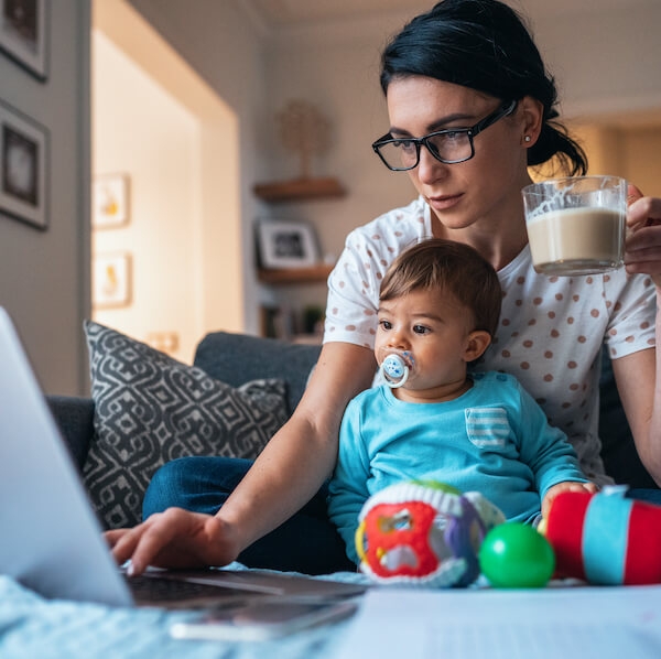 A mom working from home with a baby on her lap