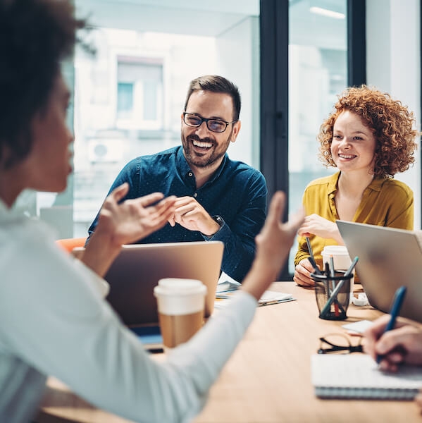 Focus group of individuals smiling