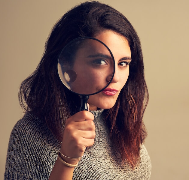 Secondary research - woman with magnifying glass