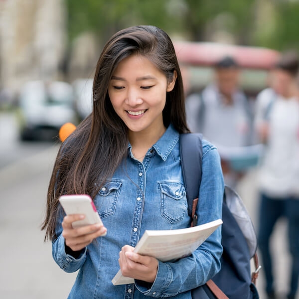 Student happily taking a survey