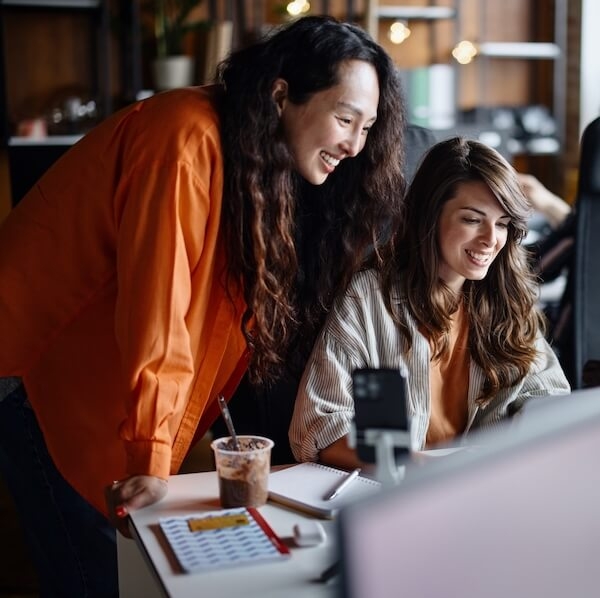 Users smiling at a computer have a great experience