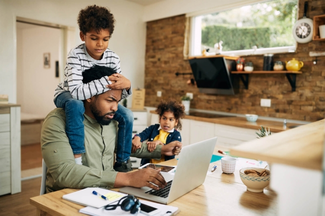 Stay at home father distracted by kids