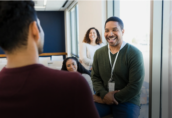 Colleagues chatting in a conference room