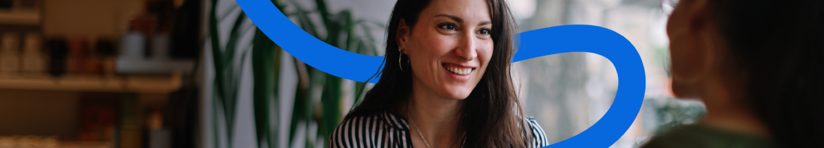 An image of a woman smiling with an stylized blue line illustration across her