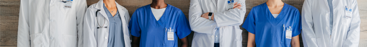 Doctors and nurses standing against a backdrop