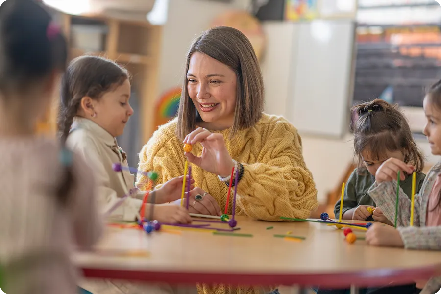 Elementary school teacher working with a student
