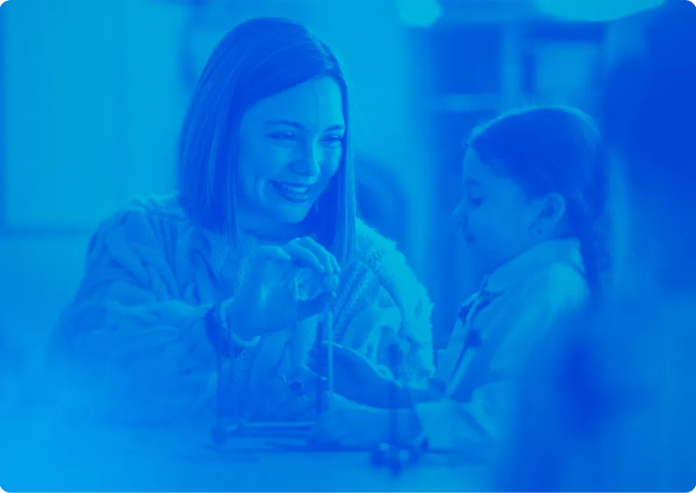 Elementary school teacher working with a student