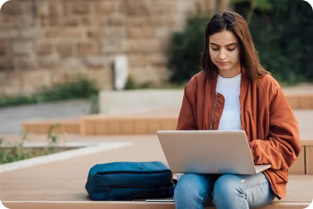 a student studying on her laptop