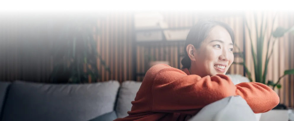 A woman resting on a couch.