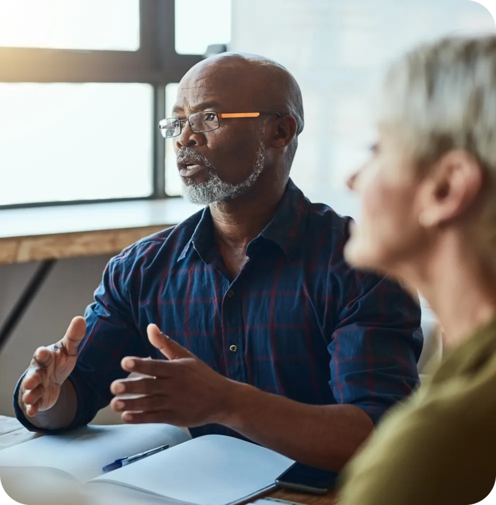 Two people discussing business